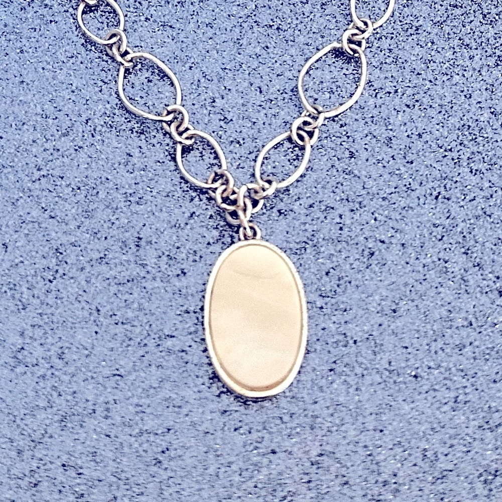 EUC mother-of-pearl necklace with a matching pair of earrings